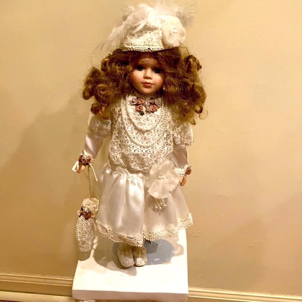 Porcelain doll with satan and lace trim dress with umbrella 15 inches
